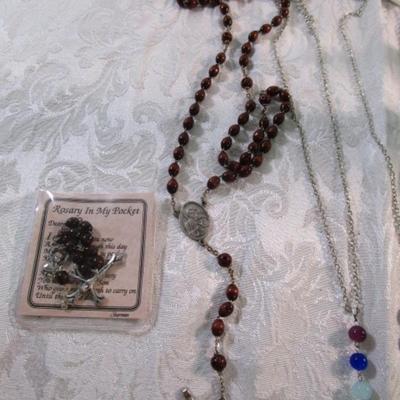 Sale Photo Thumbnail #205: 2 necklaces, 2 rosaries, 1 standing decorative plaque 6-1/2" wide x 9-3/8" tall, 1 magnet