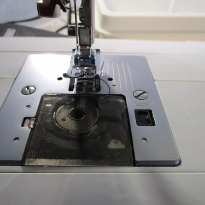 Sale Photo Thumbnail #399: Teacher's model, 27 built-in stiches, 1-step button holer, has free arm option, Like new condition, includes attachments, Model 6550