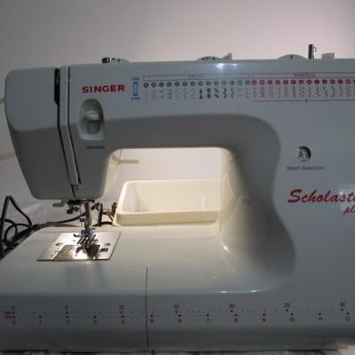 Sale Photo Thumbnail #396: Teacher's model, 27 built-in stiches, 1-step button holer, has free arm option, Like new condition, includes attachments, Model 6550