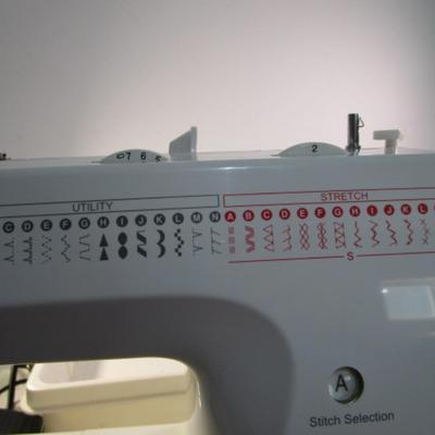 Sale Photo Thumbnail #397: Teacher's model, 27 built-in stiches, 1-step button holer, has free arm option, Like new condition, includes attachments, Model 6550