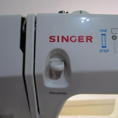 Sale Photo Thumbnail #398: Teacher's model, 27 built-in stiches, 1-step button holer, has free arm option, Like new condition, includes attachments, Model 6550