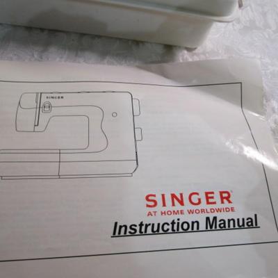 Sale Photo Thumbnail #405: Teacher's model, 27 built-in stiches, 1-step button holer, has free arm option, Like new condition, includes attachments, Model 6550