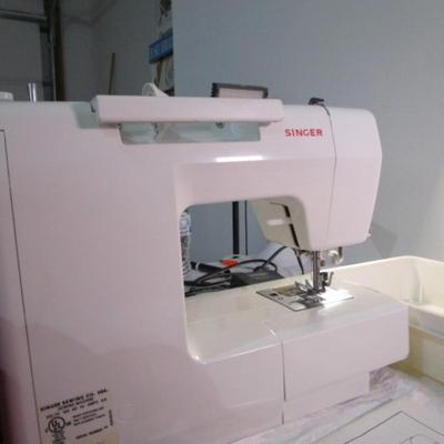 Sale Photo Thumbnail #401: Teacher's model, 27 built-in stiches, 1-step button holer, has free arm option, Like new condition, includes attachments, Model 6550