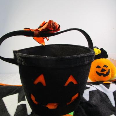Sale Photo Thumbnail #433: Happy Halloween doormat,  new electric jack-o-lantern, Halloween basket & stuffed pumpkin, Doormat untested & takes 3 AG13 batteries not included, 2 bags Halloween confetti
