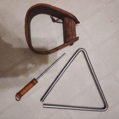 triangle and wooden stirrup