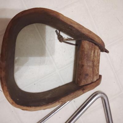 triangle and wooden stirrup