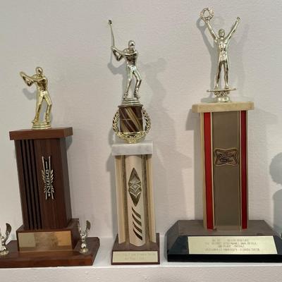 Vintage trophies with troll and Simpson figure