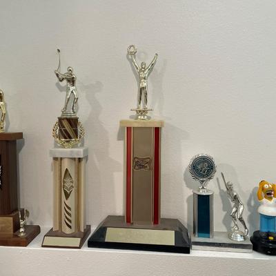 Vintage trophies with troll and Simpson figure