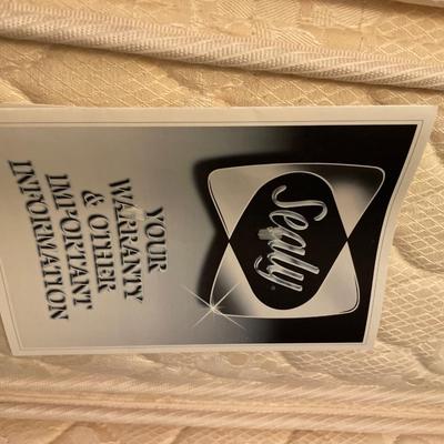 Full size Sealy Posturepedic mattress with bedding and frame