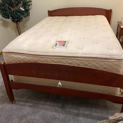Full size Sealy Posturepedic mattress with bedding and frame