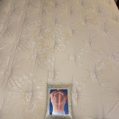 Full size Sealy Posturepedic mattress with bedding and frame