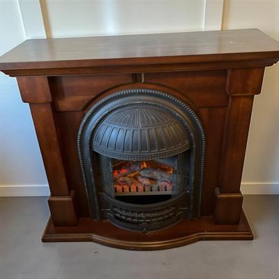 Sale Photo Thumbnail #666: Dimplex Electric Fireplace with Walnut Mantel Surround  Working and heats up.  Includes instructions and original Invoice
Approximately 47"X 17"X40"