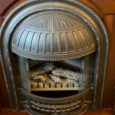 Sale Photo Thumbnail #665: Dimplex Electric Fireplace with Walnut Mantel Surround  Working and heats up.  Includes instructions and original Invoice
Approximately 47"X 17"X40"