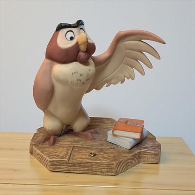 Sale Photo Thumbnail #673: Walt Disney Winnie The Pooh and Friends Owl Figurine  "You've done A Very Grand Thing"
Tip of wing has been broken and repaired.
Approximately 5"X5"