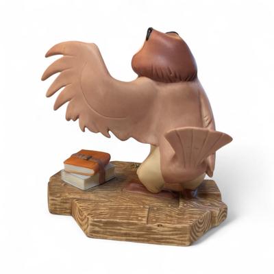 Sale Photo Thumbnail #672: Walt Disney Winnie The Pooh and Friends Owl Figurine  "You've done A Very Grand Thing"
Tip of wing has been broken and repaired.
Approximately 5"X5"