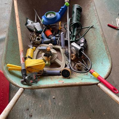 Wheelbarrow full of lawn care items