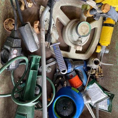 Wheelbarrow full of lawn care items