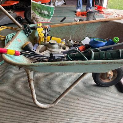 Wheelbarrow full of lawn care items