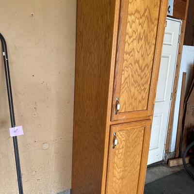 Wooden Cabinet located in the garage
