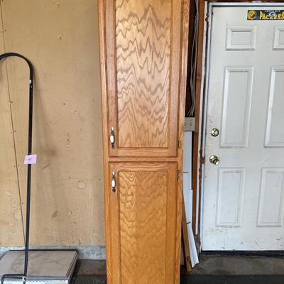 Wooden Cabinet located in the garage
