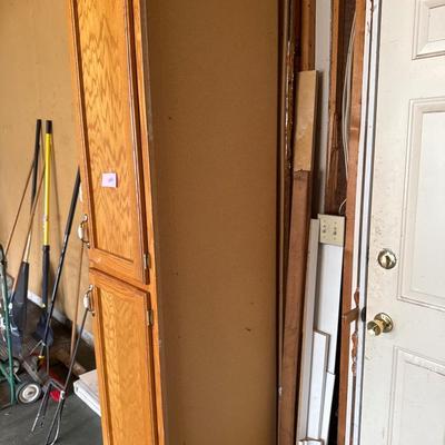 Wooden Cabinet located in the garage