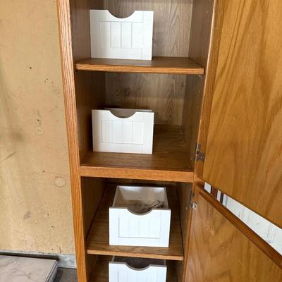 Wooden Cabinet located in the garage