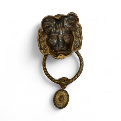 Sale Photo Thumbnail #716: Brass Lion Head Door Knocker and Strike Plate
Approximately 8" tall