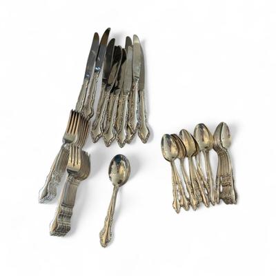 Sale Photo Thumbnail #1129: International Silverware Set    Includes:   11 Knives, 11 Dinner Forks, 12 Salad Forks, 20 Spoons, 8 Soup Spoons, and 12 assorted serving pieces.  See Photos