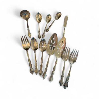Sale Photo Thumbnail #1128: International Silverware Set    Includes:   11 Knives, 11 Dinner Forks, 12 Salad Forks, 20 Spoons, 8 Soup Spoons, and 12 assorted serving pieces.  See Photos