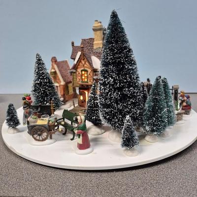 Sale Photo Thumbnail #131: Includes the Childe Pond & Skaters, Christmas Carol Reading, Coffee Stall, Melancholy Tavern, and 
numerous trees.  The turntable rotates, electric power with light.  The turntable is missing one small piece on the understand, but it stills runs 
very wel