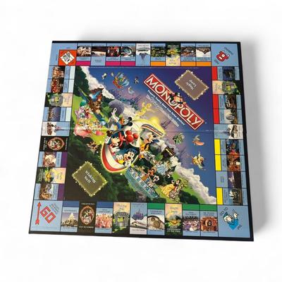 Sale Photo Thumbnail #1210: Disney Theme Park Monopoly Game in Metal Tin.  Missing Dice, Houses and Player pieces.