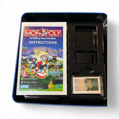 Sale Photo Thumbnail #1211: Disney Theme Park Monopoly Game in Metal Tin.  Missing Dice, Houses and Player pieces.