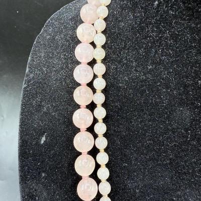 Sale Photo Thumbnail #106: Both necklaces are the same length (approx. 28"), one has a small bead and the other has a larger bead.  Both in good condition.