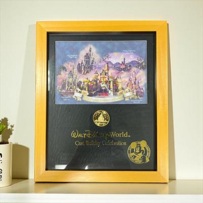Sale Photo Thumbnail #1311: Walt Disney World Collectors Society Box including, The Magic Begins With Me Book, On With The Show Photo, Cast Holiday Celebration Framed Photo, I Year Anniversary Card, Two Disney Dollars, One December 31, 1999 Entrance Ticket, Disney Cash Handling Manu