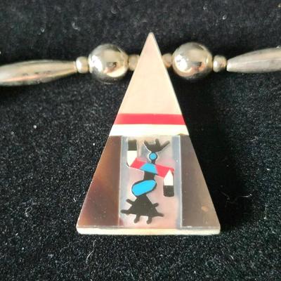 Sale Photo Thumbnail #171: The pendant is shell inlay with Mother of Pearl, turquoise, and sterling.  Zoom in to see the beautiful inlay work.  
The necklace is composed mostly of sterling beads.  Choker length.  Retail is $80 to $400.