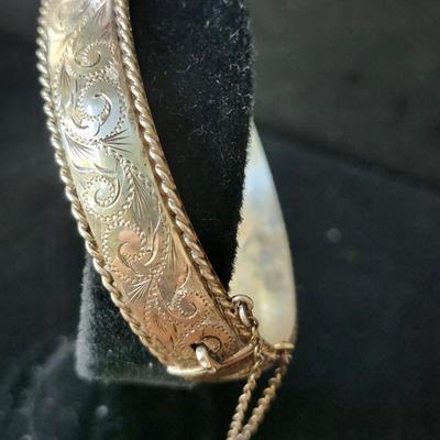 Sale Photo Thumbnail #185: Ornate 925 hinged bangle, with rope border,  Safety catch and chain. 
Retail $250
