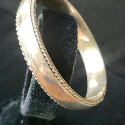 Sale Photo Thumbnail #184: Ornate 925 hinged bangle, with rope border,  Safety catch and chain. 
Retail $250