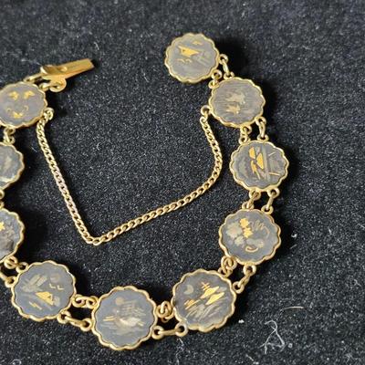 Sale Photo Thumbnail #187: The links on this bracelet are double sided, with Damascene inlay on one side and engraved on the opposite side. 
Amita Japan 
Retail $125 to $250 
Very nice condition