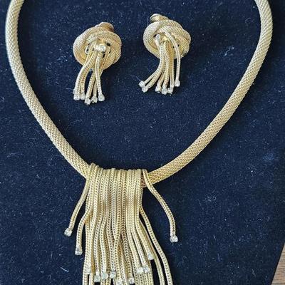 Sale Photo Thumbnail #212: Gold tone T - rhinestone waterfall design. Signed
Necklace is 15.5 inches.  Clip earrings
excellent condition 
Retail $300.00