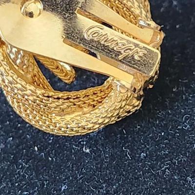 Sale Photo Thumbnail #210: Gold tone T - rhinestone waterfall design. Signed
Necklace is 15.5 inches.  Clip earrings
excellent condition 
Retail $300.00