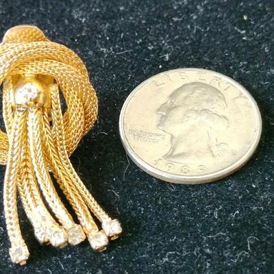 Sale Photo Thumbnail #209: Gold tone T - rhinestone waterfall design. Signed
Necklace is 15.5 inches.  Clip earrings
excellent condition 
Retail $300.00