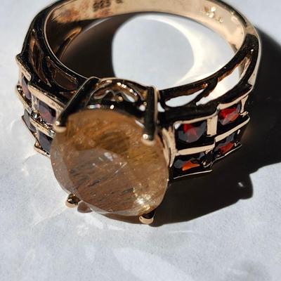 Sale Photo Thumbnail #222: 925    INDIA   SIZE 8
Nice condition
Rutilated quartz has ribbons of black tourmaline running through the stone.  
The garnets set off the quartz stone very well.