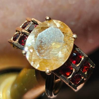 Sale Photo Thumbnail #223: 925    INDIA   SIZE 8
Nice condition
Rutilated quartz has ribbons of black tourmaline running through the stone.  
The garnets set off the quartz stone very well.