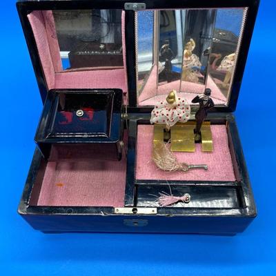 Sale Photo Thumbnail #226: With key, music works.  Dancing Couple
Mirrored interior
Mother of Pearl inlay
Small chips on the front