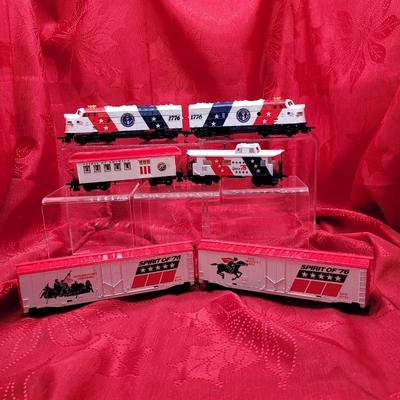 Sale Photo Thumbnail #234: HO Scale train set, Bicenntennial 
4 engines, 2 box cars, passenger car and caboose.
Most are in original boxes.  
Retails $149 to $275