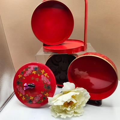 Sale Photo Thumbnail #240: Stackable, tiered lunch food carrier, made with red lacquer with black floral pattern.
Excellent condition