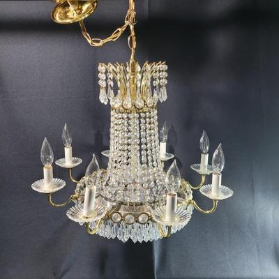 Sale Photo Thumbnail #246: This is an amazing piece,  perfect for an entryway or large dining room.
Multi-tiered, 8 candle
It needs electrician installation, hard wired
There are crystal prisms at the top center, and below mirrored base
3 center lights
22 inches tall, 22 inches wid