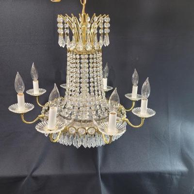 Sale Photo Thumbnail #245: This is an amazing piece,  perfect for an entryway or large dining room.
Multi-tiered, 8 candle
It needs electrician installation, hard wired
There are crystal prisms at the top center, and below mirrored base
3 center lights
22 inches tall, 22 inches wid