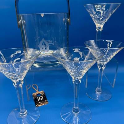 Sale Photo Thumbnail #260: Orrefors crystal ice bucket. it has a flea bite on the rim.  6.5 inches tall 
4 vintage champagne / sherbert stems, good condition( 1 has a flea bite)