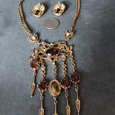 Sale Photo Thumbnail #272: Chatelaine style necklace with amber colored stones and faux pearls, with matching clip earrings.